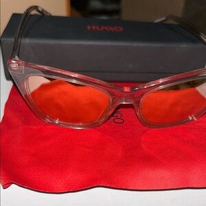 HUGO Transparent Frame Sunglasses with Vibrant Red Lenses